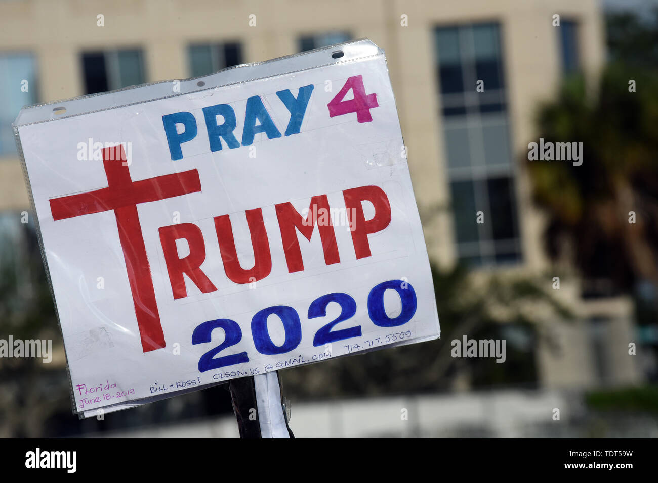Orlando, Florida, USA. 18th June, 2019. A supporter of U.S. President Donald Trump holds a sign while waiting for a Make America Great Again rally at the Amway Center on June 18, 2019 in Orlando, Florida. The rally is billed as Trump's kick-off event for his campaign for re-election in 2020. (Paul Hennessy/Alamy) Credit: Paul Hennessy/Alamy Live News Stock Photo