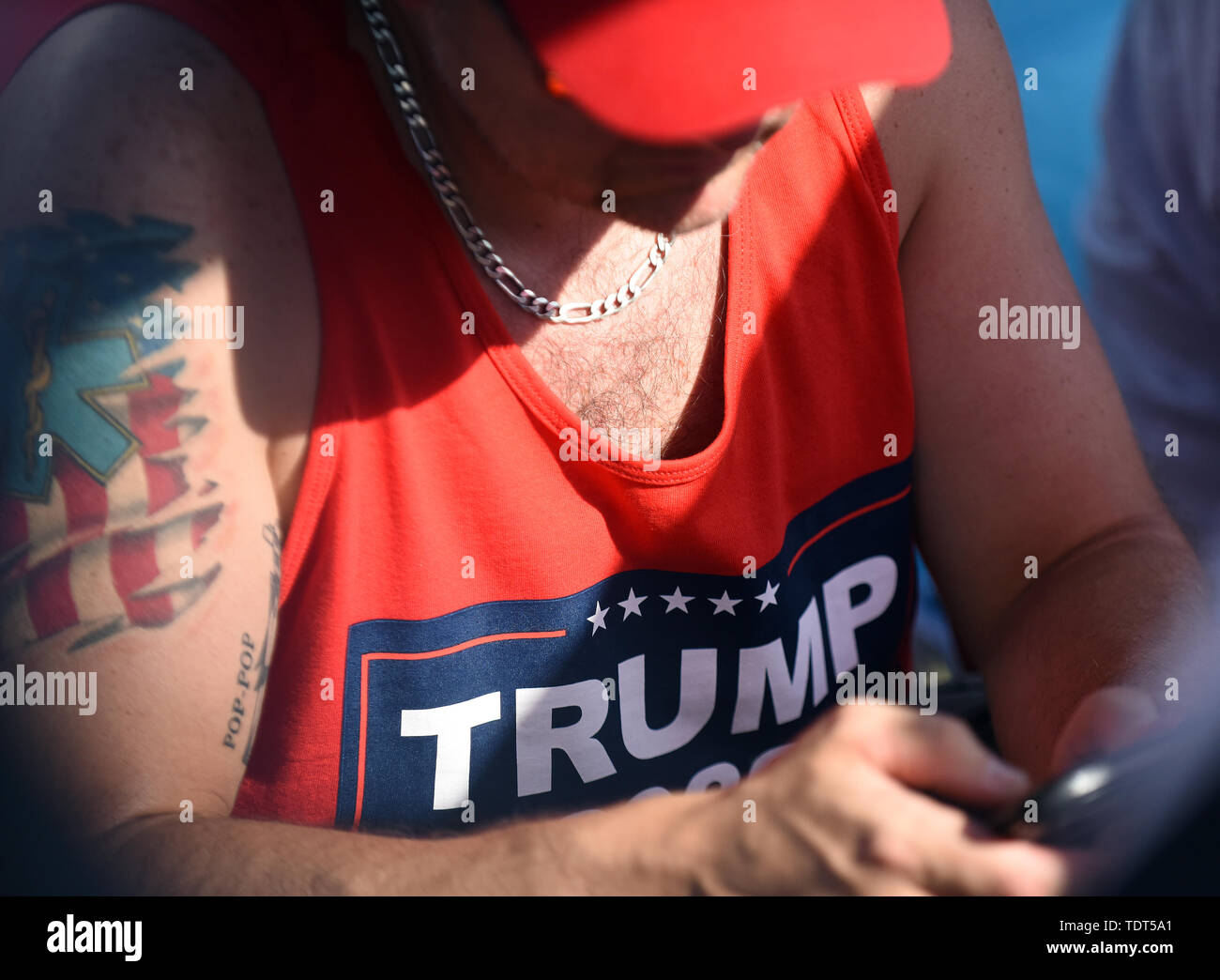Orlando, Florida, USA. 18th June, 2019. A supporter of U.S. President Donald Trump waits in line for a Make America Great Again rally at the Amway Center on June 18, 2019 in Orlando, Florida. The rally is billed as Trump's kick-off event for his campaign for re-election in 2020. (Paul Hennessy/Alamy) Credit: Paul Hennessy/Alamy Live News Stock Photo
