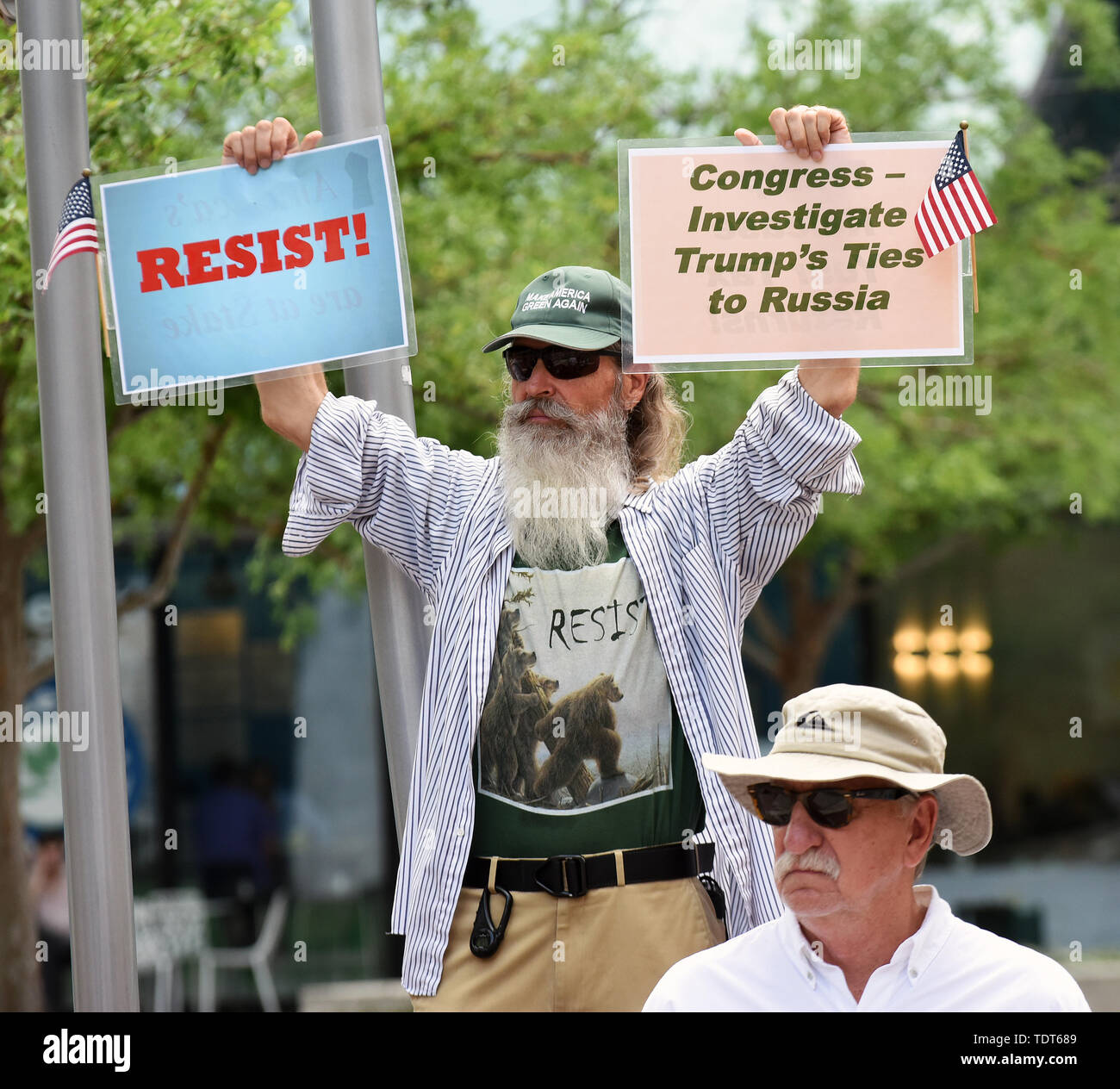 Orlando, Florida, USA. 18th June, 2019. Protesters demonstrate against U.S. President Donald Trump near the site of a Make America Great Again rally at the Amway Center on June 18, 2019 in Orlando, Florida. The rally is billed as Trump's kick-off event for his campaign for re-election in 2020. Credit: Paul Hennessy/Alamy Live News Stock Photo