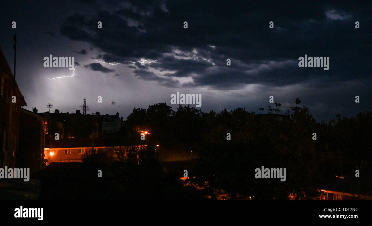 Brighton UK 18th June 2019 - A thunder and lightning storm lights up the skies above the Queens Park area of Brighton this evening as they move across the south east of Britain bringing a threat of more flooding to some parts of the UK . Credit : Simon Dack / Alamy Live News Stock Photo