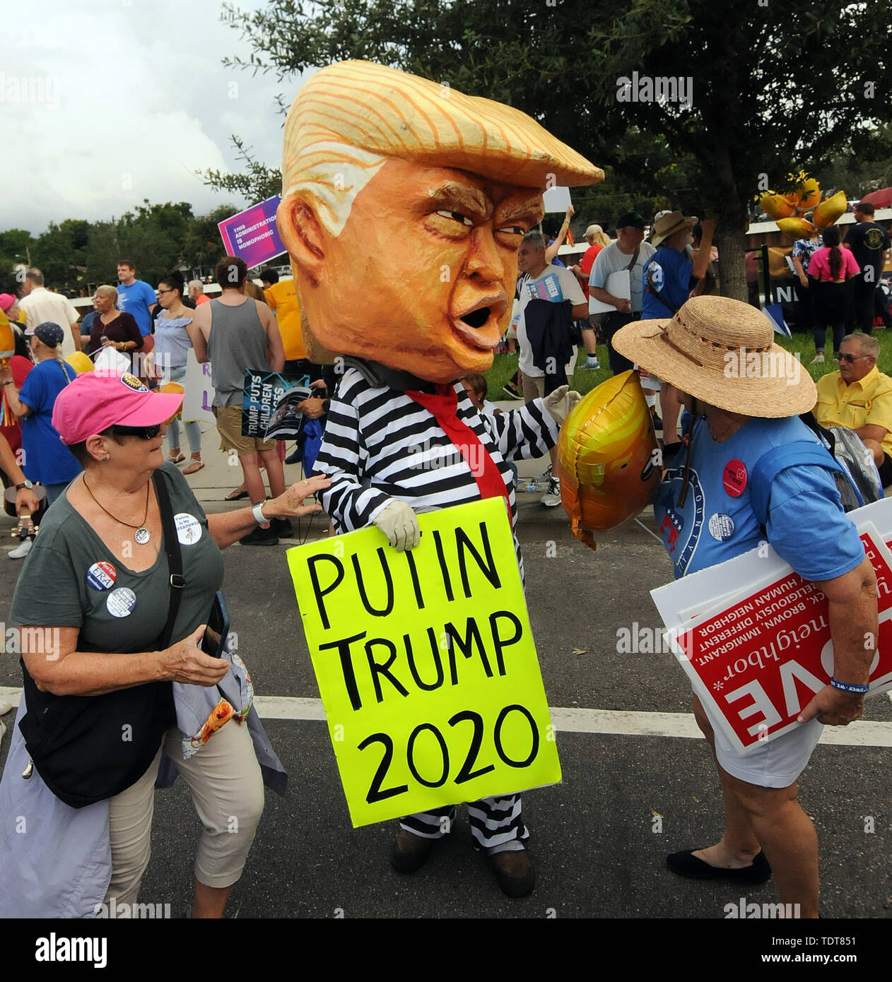 Orlando, Florida, USA. 18th June, 2019. Protesters demonstrate against U.S. President Donald Trump near the site of a Make America Great Again rally at the Amway Center on June 18, 2019 in Orlando, Florida. The rally is billed as Trump's kick-off event for his campaign for re-election in 2020. Credit: Paul Hennessy/Alamy Live News Stock Photo