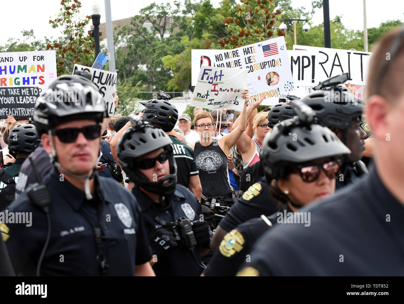 Orlando, Florida, USA. 18th June, 2019. Police separate Trump supporters and Trump protesters near the site of a Make America Great Again rally at the Amway Center on June 18, 2019 in Orlando, Florida. The rally is billed as Trump's kick-off event for his campaign for re-election in 2020. Credit: Paul Hennessy/Alamy Live News Stock Photo