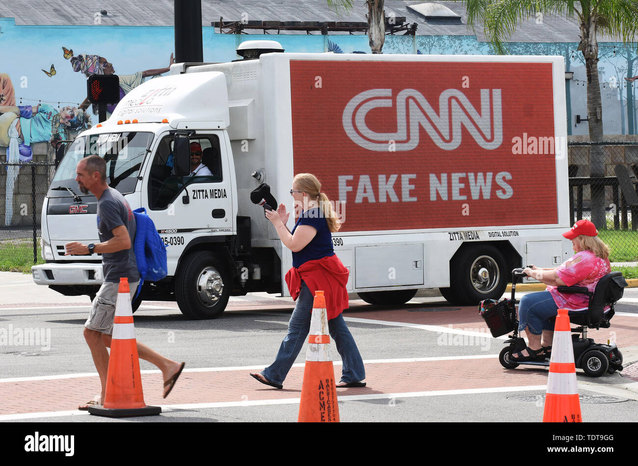 Orlando, Florida, USA. 18th June, 2019. A CNN Fake News sign is driven on a truck near U.S. President Donald Trump's Make America Great Again rally at the Amway Center on June 18, 2019 in Orlando, Florida. This is the kick-off event for Trump's campaign for re-election in 2020. Credit: Paul Hennessy/Alamy Live News Stock Photo