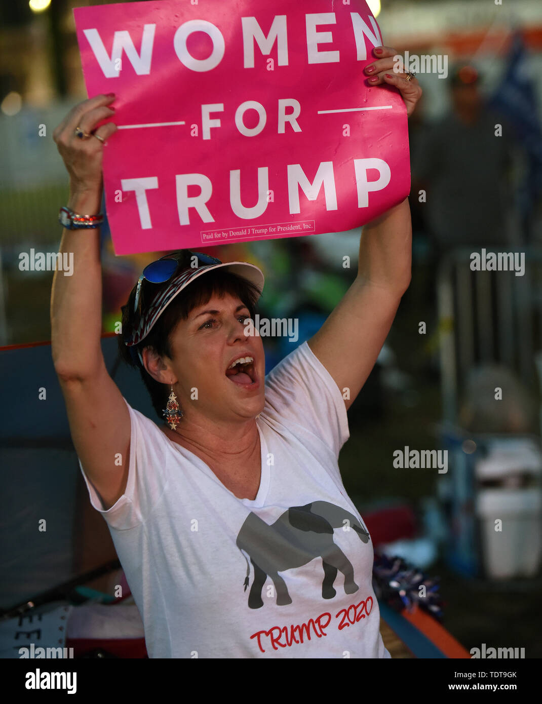 Orlando, Florida, USA. 18th June, 2019. A supporter of U.S. President Donald Trump reacts as she views Trump's remarks at a Make America Great Again rally on a video screen outside the Amway Center on June 18, 2019 in Orlando, Florida. This is the kick-off event for Trump's campaign for re-election in 2020. Credit: Paul Hennessy/Alamy Live News Stock Photo