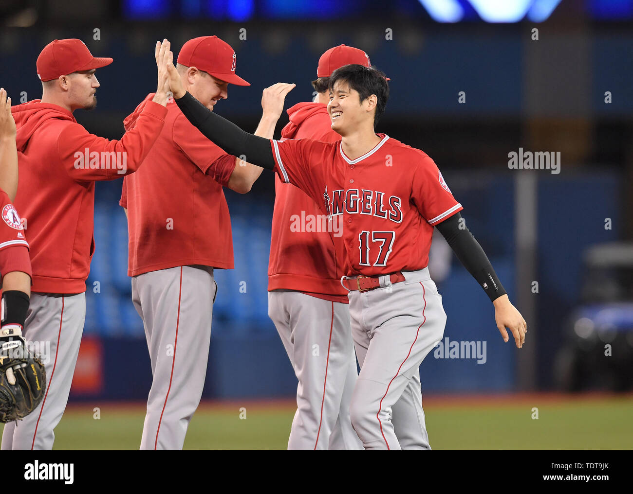 Toronto, Canada. 17th June, 2019. Los Angeles Angels' Shohei Ohtani (17) high fives his teammates after winning the Major League Baseball game against the Toronto Blue Jays at Rogers Centre in Toronto, Canada, June 17, 2019. Credit: AFLO/Alamy Live News Stock Photo