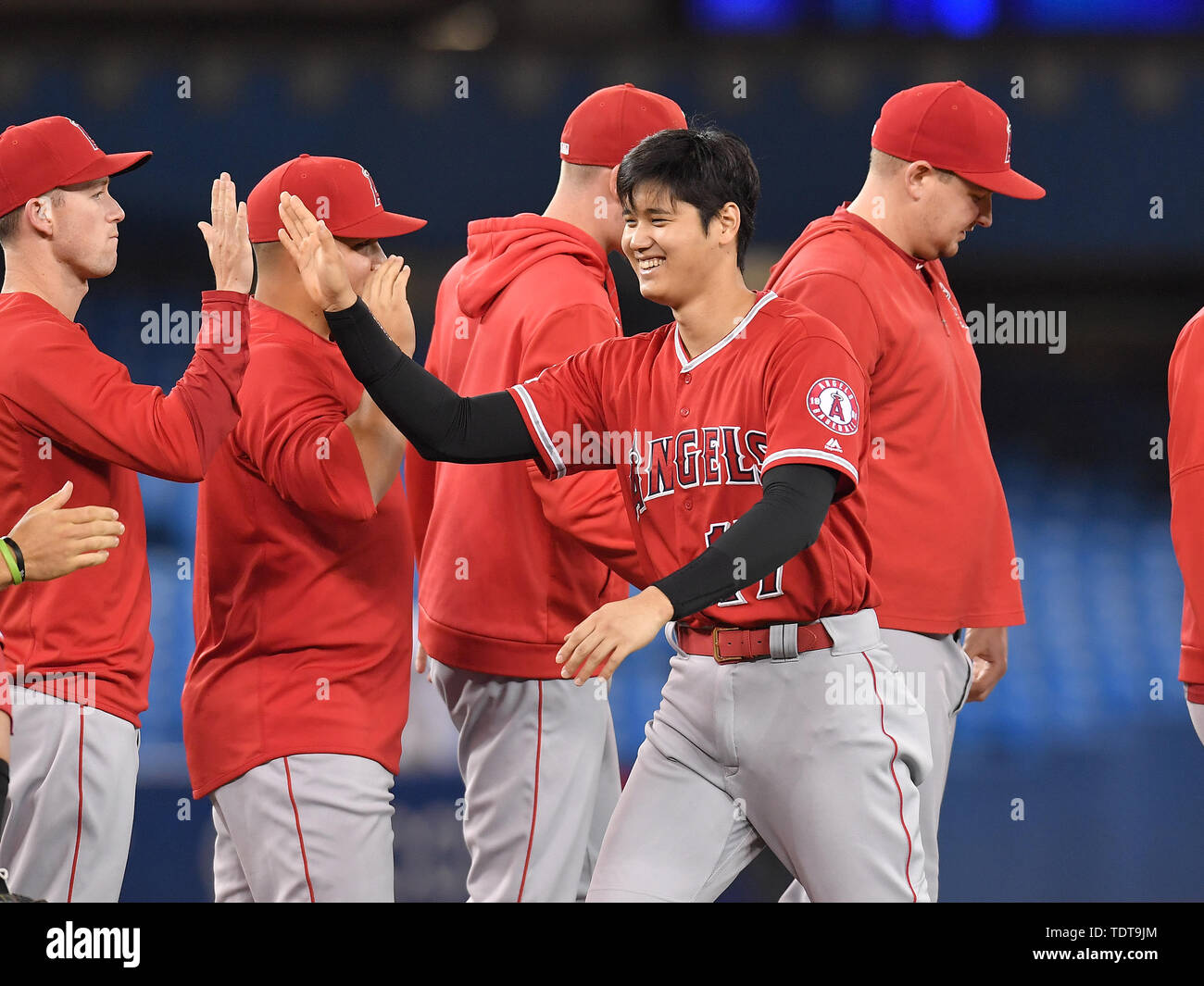 Toronto, Canada. 17th June, 2019. Los Angeles Angels' Shohei Ohtani (17) high fives his teammates after winning the Major League Baseball game against the Toronto Blue Jays at Rogers Centre in Toronto, Canada, June 17, 2019. Credit: AFLO/Alamy Live News Stock Photo
