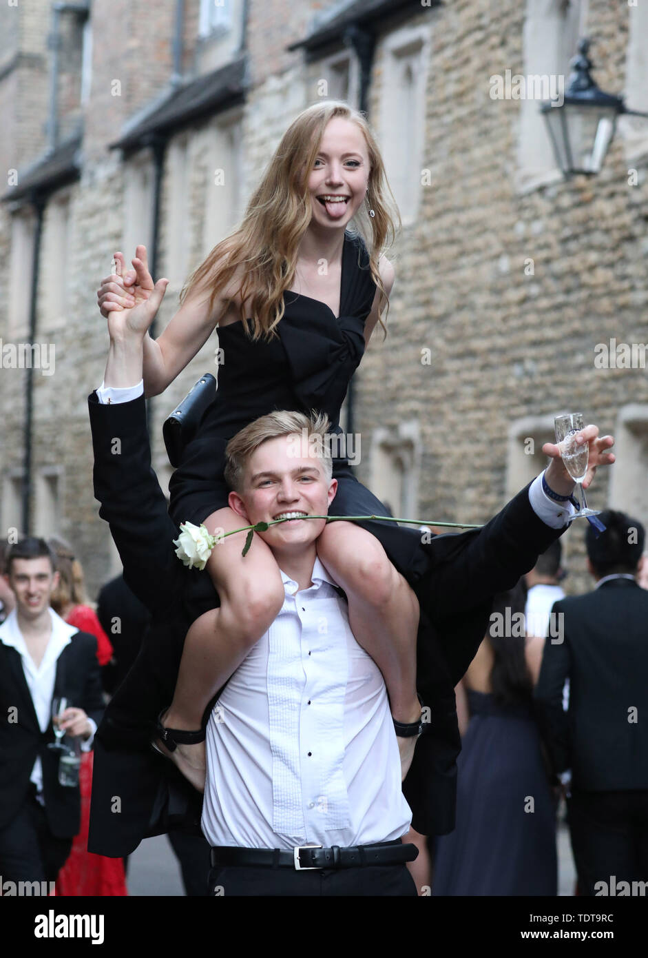 Cambridge, Cambridgeshire, UK. 18th June, 2019. University students make their way home in the early hours of the morning after celebrating the end of their exams and attending the Trinity May Ball, Cambridge, Cambridgeshire, on June 18, 2019. Credit: Paul Marriott/Alamy Live News Stock Photo