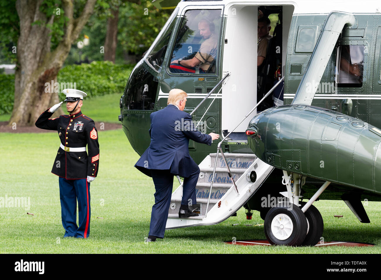 President Donald Trump boarding Marine One just prior to its departing