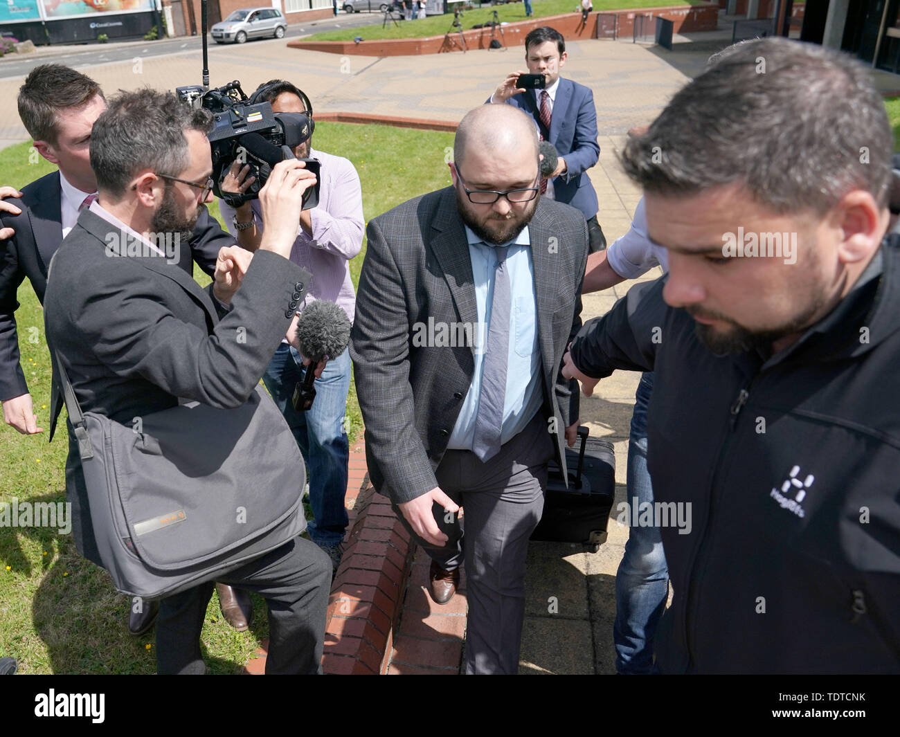 Paul Crowther, (centre) who threw milkshake over Nigel Farage, leaves North Tyneside Magistrates' Court in North Shields where he has been ordered to pay the Brexit Party leader compensation following the 'politically motivated' attack. Stock Photo