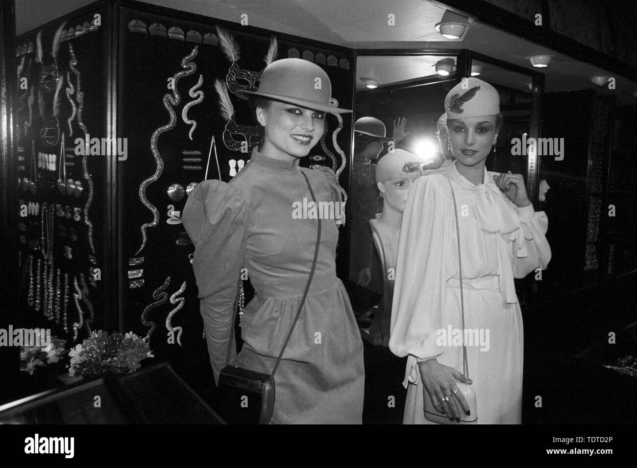 The model on the right wears a 1930s looking outfit and the model on the left also puts back the fashion clock to the leg-o'mutton sleeved era. Both women took part in the re-opening of the Biba store which reopened in new premises in London's Conduit Street. Stock Photo