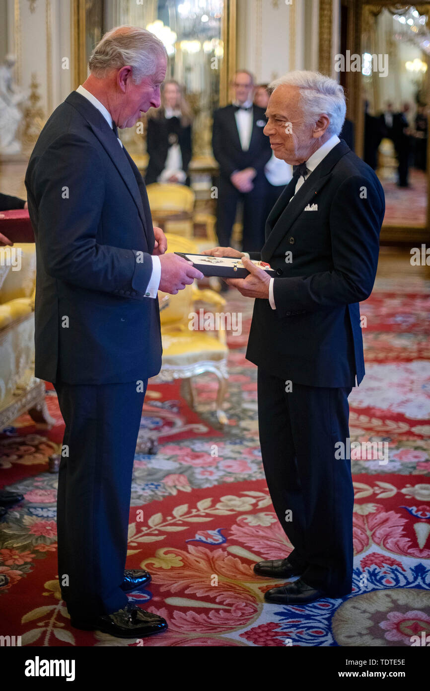 The Prince of Wales presents designer Ralph Lauren with his honorary KBE (Knight  Commander of the Order of the British Empire) for Services to Fashion in a  private ceremony at Buckingham Palace