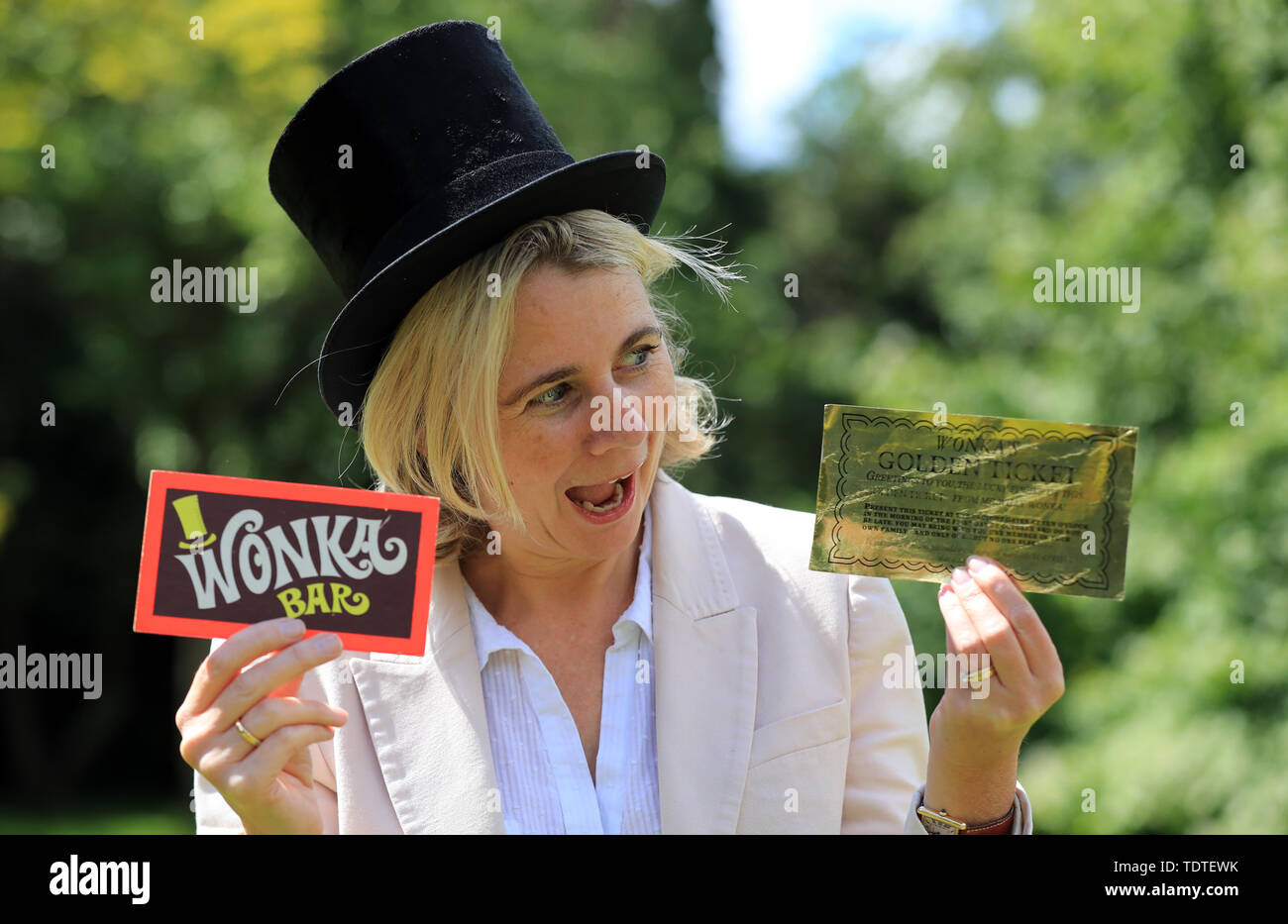 Auctioneer Catherine Southon holds two of the most iconic film props - a Golden Ticket and Wonka Bar from the 1971 film Willy Wonka & the Chocolate Factory which are to be auctioned next month and are expected to fetch ??8,000 to ??12,000. Stock Photo