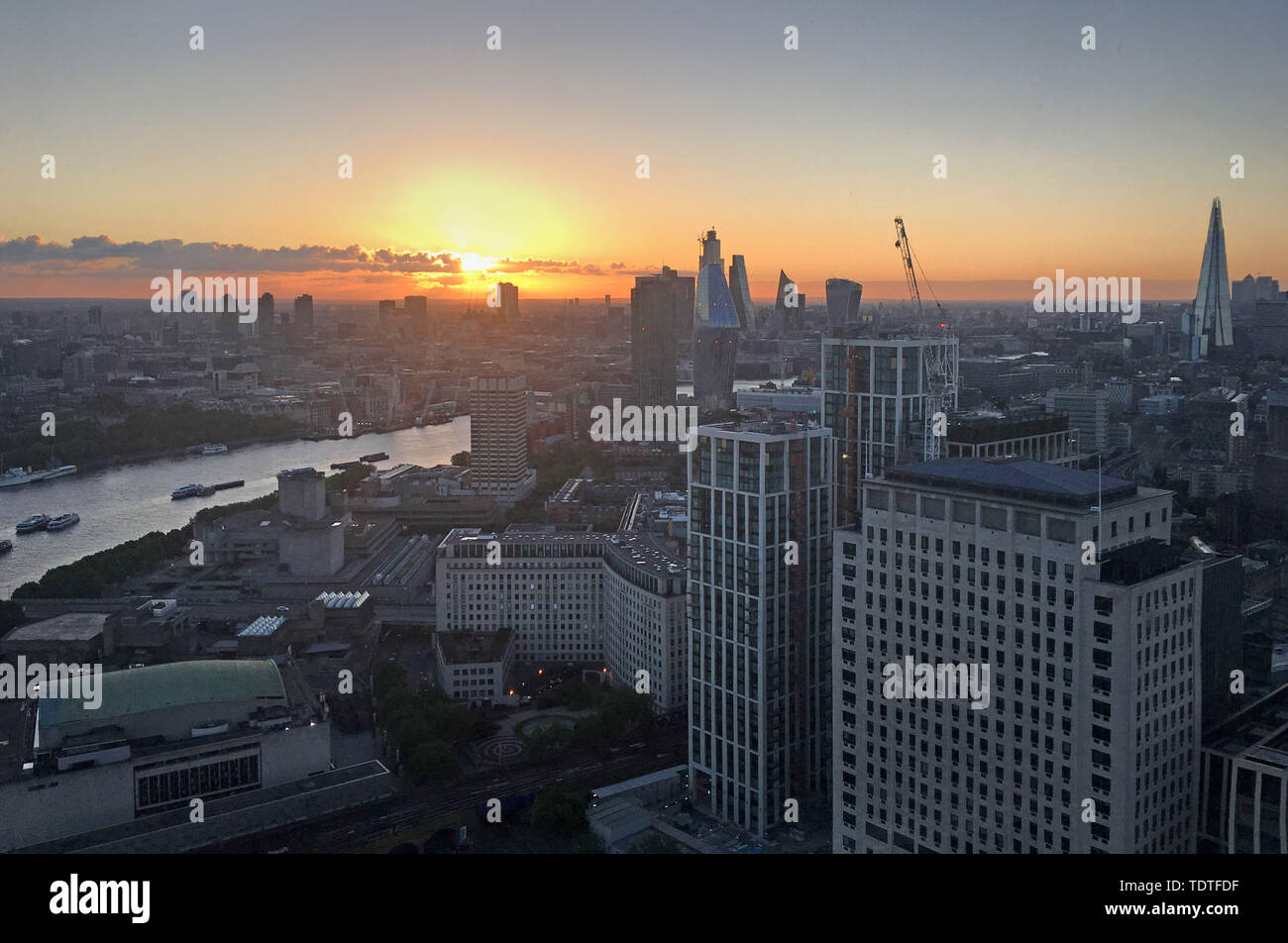 The sun rises over london during the summer solstice hi-res stock ...