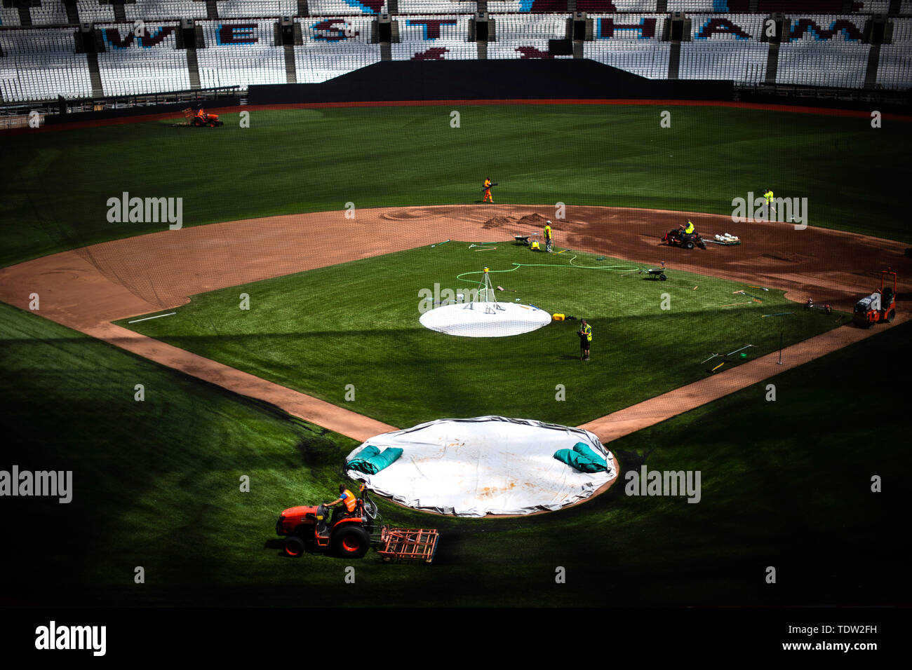 Preparations are made to transform the London Stadium in London from a football pitch to a baseball field, ahead of the first regular season Major League Baseball series to occur in Europe, when Boston Red Sox play New York Yankees. Stock Photo