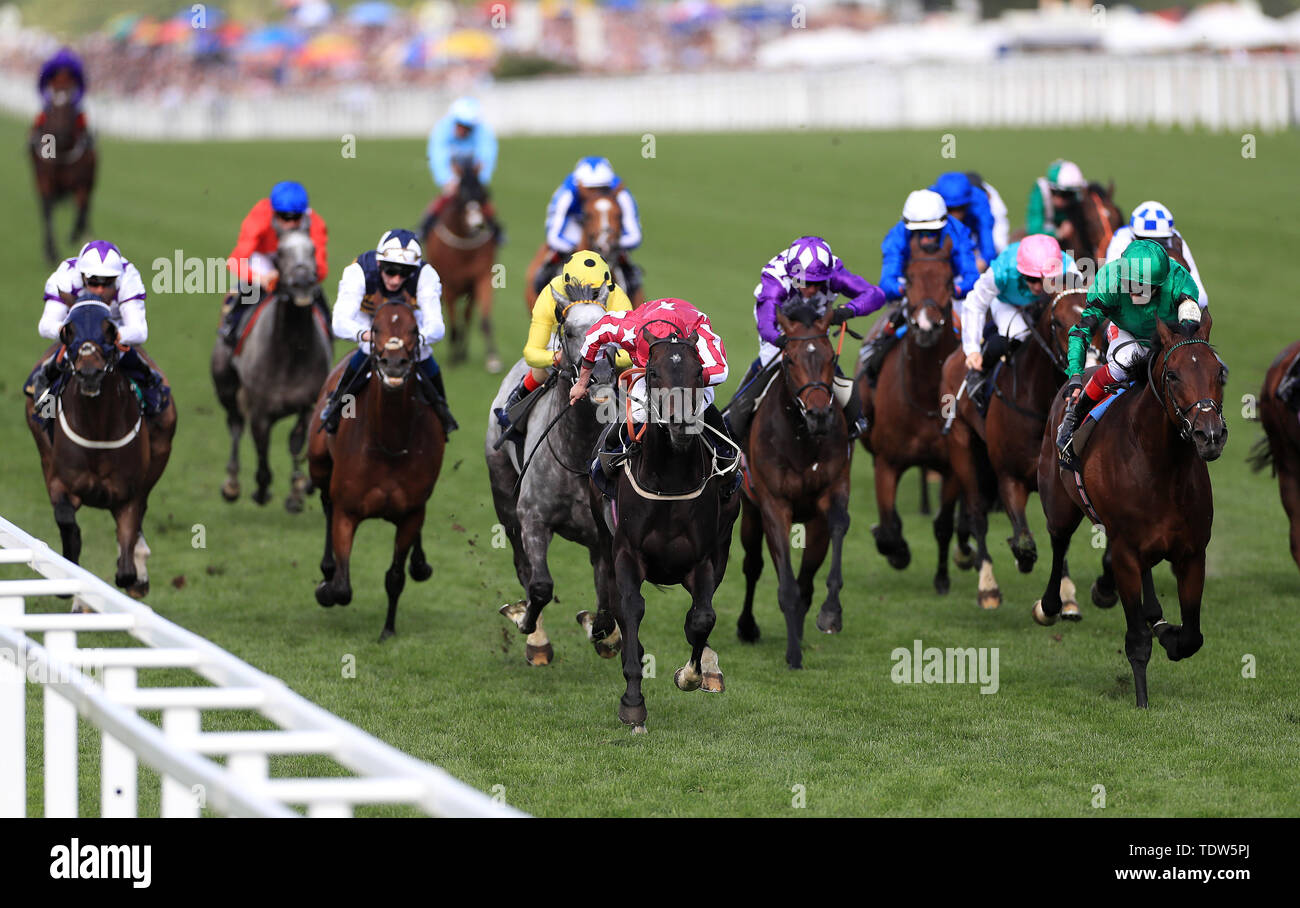 Baghdad riddeb by jockey Ryan Moore (centre) coming home to win the Duke Of Edinburgh Stakes during day four of Royal Ascot at Ascot Racecourse. Stock Photo