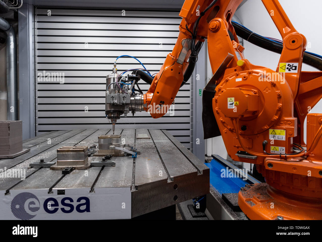 Dresden, Germany. 03rd Apr, 2019. A milling robot in the Additive Manufacturing Center Dresden (AMCD) of the Fraunhofer Institute for Material and Beam Technology IWS uses 3D printing to process a section of an optical bench, which is to be used on an ESA mission into space in 2028. Credit: Robert Michael/dpa-Zentralbild/ZB/dpa/Alamy Live News Stock Photo