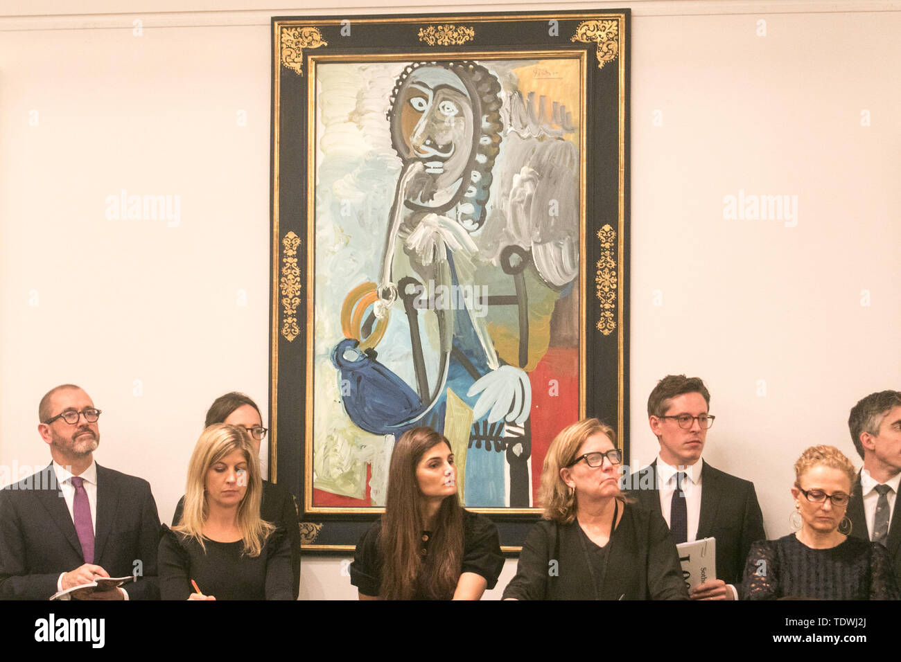 London UK. 19th June 2019. Sotheby's staff taking bids on the phone on behalf of clients  for 'Homme a la pipe' by Pablo Picasso',oil on canvas, Estimate £5,500,000, which sold at hammer for £6,500,000 at the Impressionist & Modern Art Evening Auction  at Sotheby’s London Credit: amer ghazzal/Alamy Live News Stock Photo
