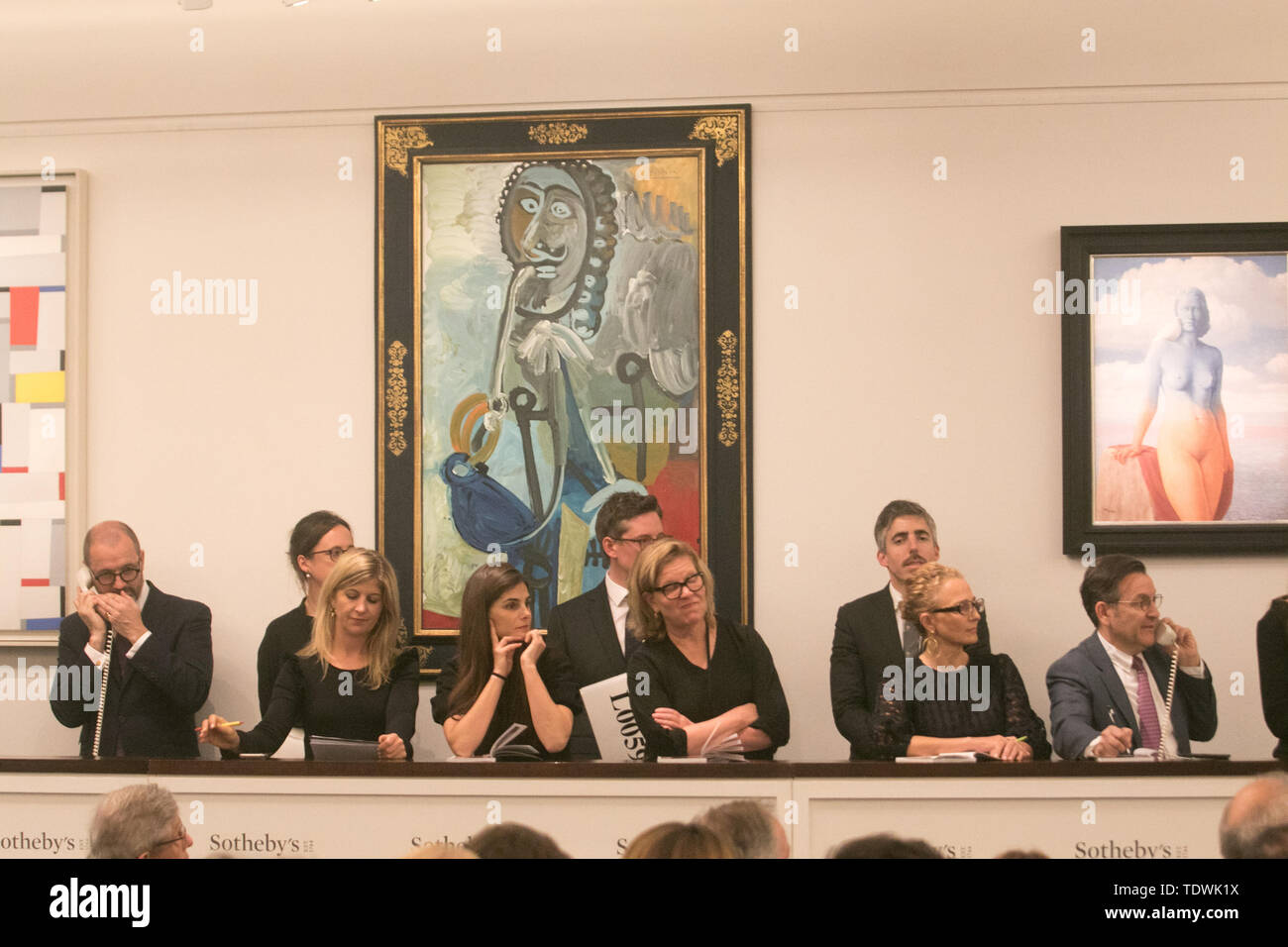 London UK. 19th June 2019. Sotheby's staff taking bids on the phone on behalf of clients  for 'Homme a la pipe' by Pablo Picasso',oil on canvas, Estimate £5,500,000, which sold at hammer for £6,500,000 at the Impressionist & Modern Art Evening Auction  at Sotheby’s London Credit: amer ghazzal/Alamy Live News Stock Photo