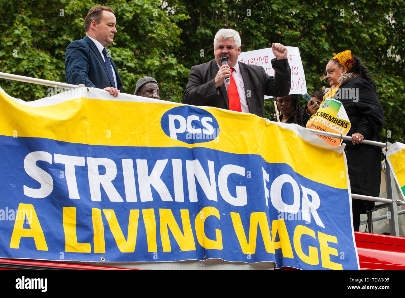 London, UK. 19 June, 2019. Hugh Gaffney, Scottish Labour Party MP for Coatbridge, Chryston and Bellshill, addresses outsourced catering, security, postal, porter and cleaning staff belonging to the Public & Commercial Services Union (PCS) and working at the Department for Business, Energy and Industrial Strategy (BEIS) via contractors ISS World and Aramark at a rally outside Parliament on the third day of continuing industrial action for the London Living Wage, terms and conditions comparable to the civil servants they work alongside and an end to outsourcing. Credit: Mark Kerrison/Alamy Live  Stock Photo