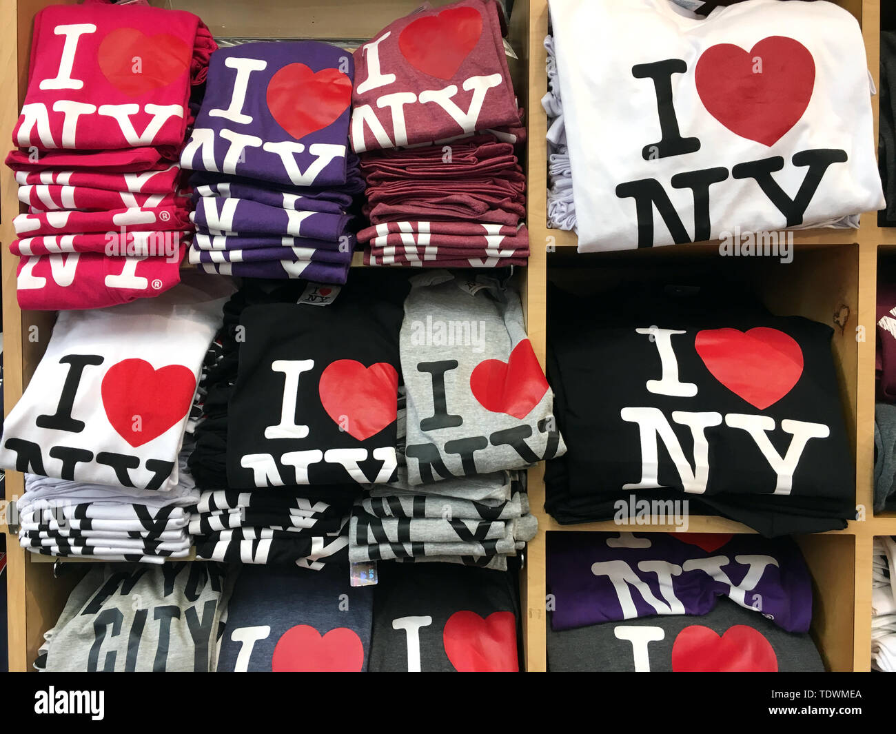 New York, USA. 11th June, 2019. T-shirts with the 'I love New York' logo are offered for sale in a souvenir shop. Hardly any logo in the world is so well known and has been copied so often. Inventor Milton Glaser got just $2000 for it, but the design laid the foundation for his steep career. Glaser turns 90 on 26.06.2019. (to dpa 'inventor of the 'I love New York' logo: US designer Glaser turns 90') Credit: Christina Horsten/dpa/Alamy Live News Stock Photo