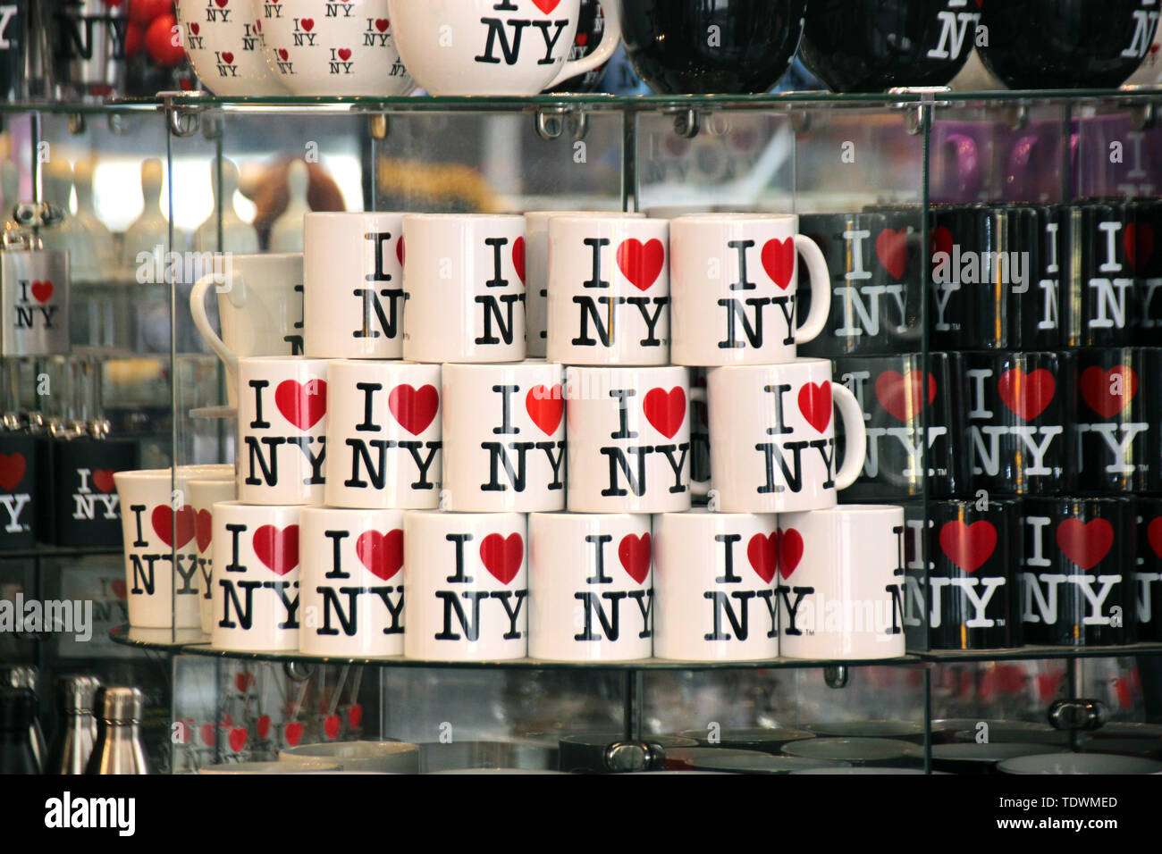 New York, USA. 11th June, 2019. Cups with the 'I love New York' logo are offered for sale in a souvenir shop. Hardly any logo in the world is so well known and has been copied so often. Inventor Milton Glaser got just $2000 for it, but the design laid the foundation for his steep career. Glaser turns 90 on 26.06.2019. (to dpa 'inventor of the 'I love New York' logo: US designer Glaser turns 90') Credit: Christina Horsten/dpa/Alamy Live News Stock Photo