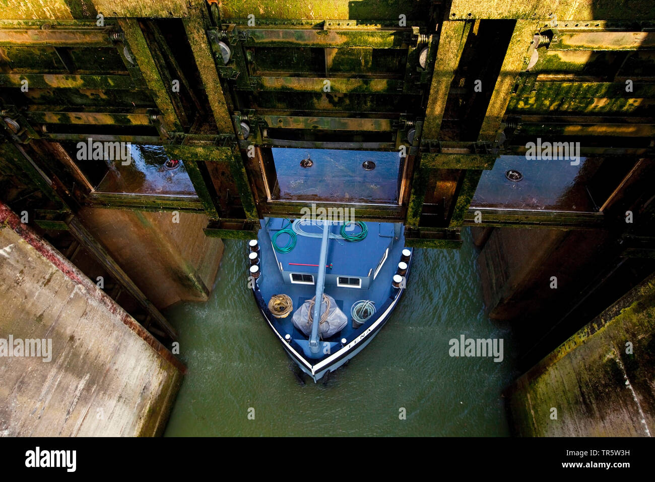 cargo vessel leaving the lock Grosse Schleuse Friedrichsfeld, Wesel-Datteln Canal, Germany, North Rhine-Westphalia, Ruhr Area, Voerde Stock Photo