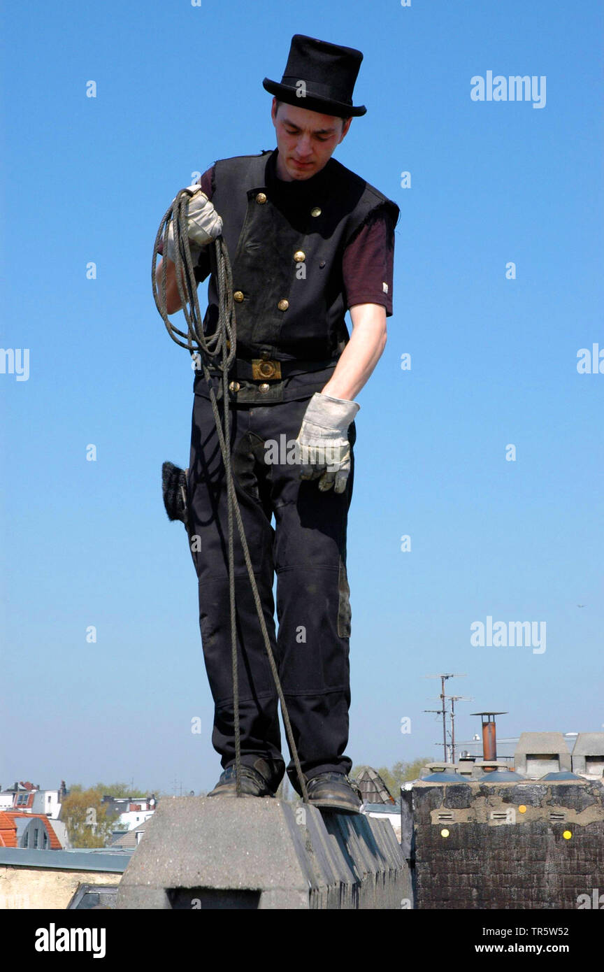 chimney sweeper on a roof, Germany Stock Photo