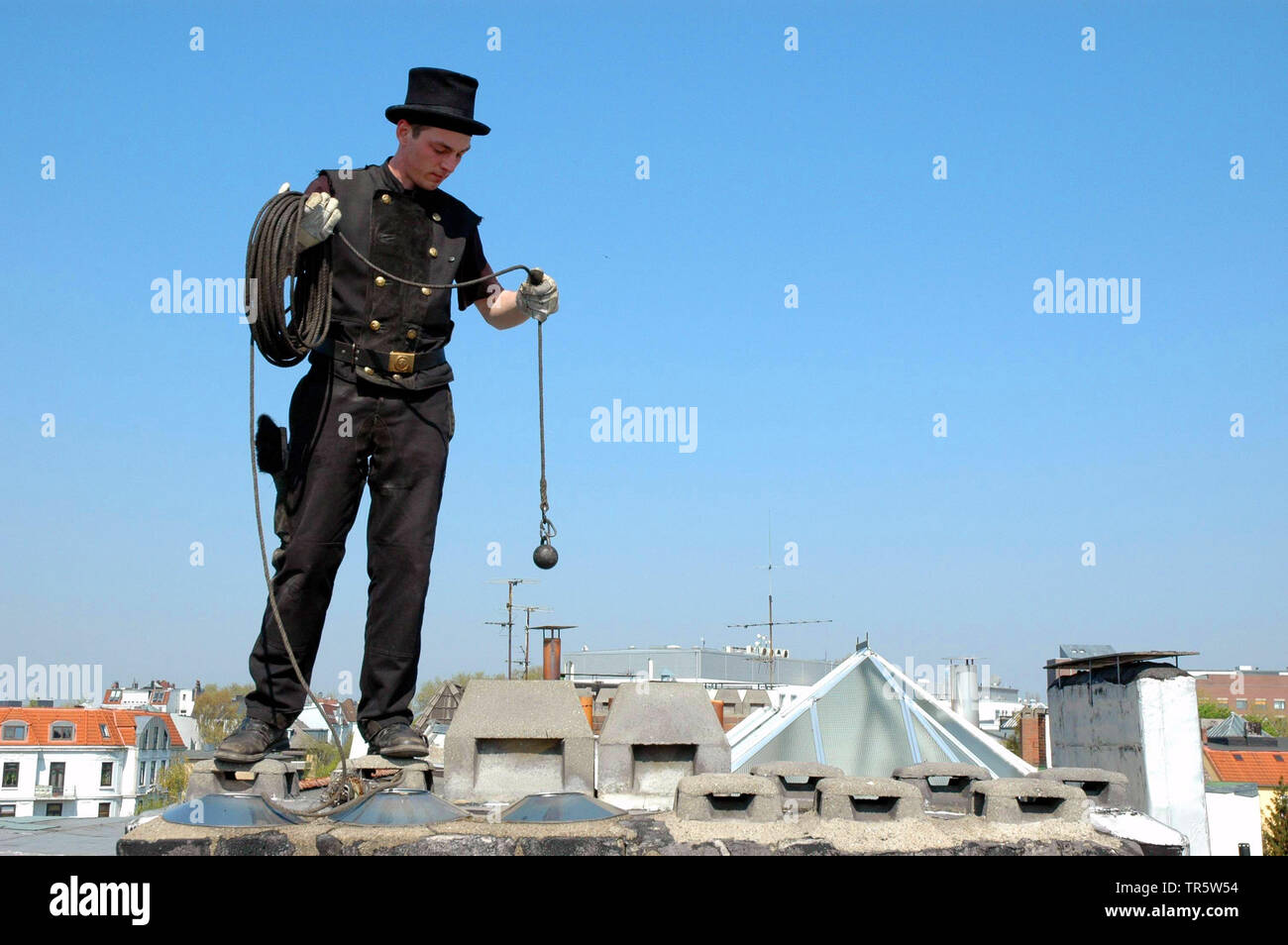 chimney sweeper on a roof, Germany Stock Photo