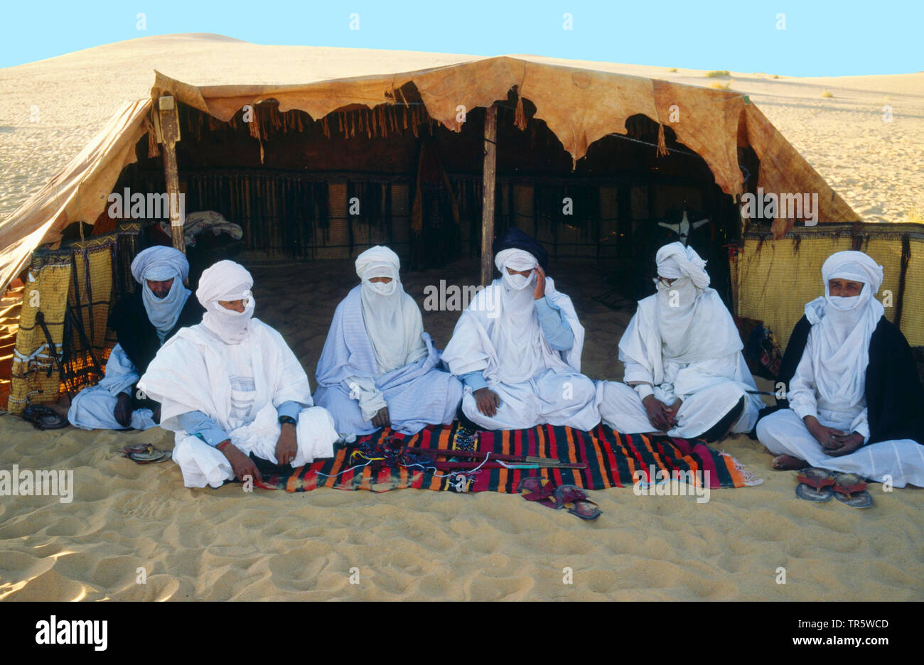 Tuaregs with Litham in front of a tent in the Sahara, Libya, 2 4 Stock Photo