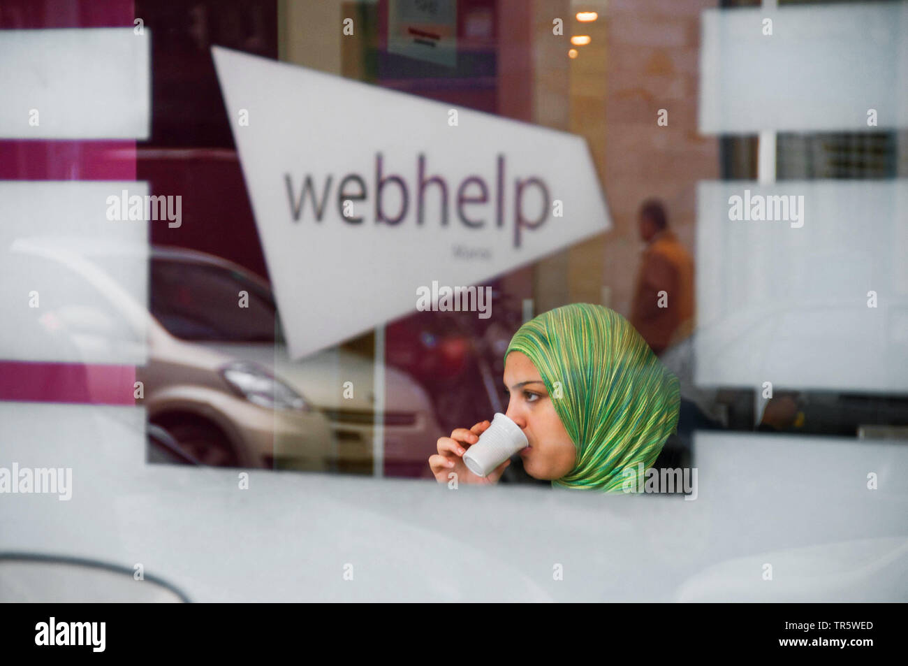 marrokan woman with coffee in an internet cafe, Morocco, Rabat Stock Photo