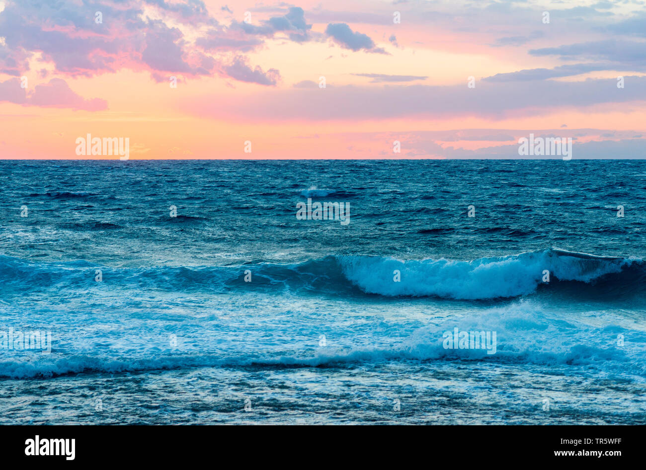 breaking waves at the coast of North Cyprus at sunset, Cyprus Stock Photo