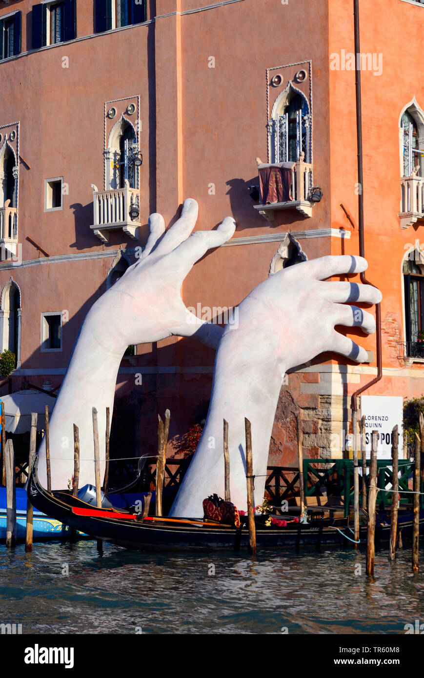 Sculpture Support, monumental hand underpinning a hotel in Venice, Italy, Venice Stock Photo