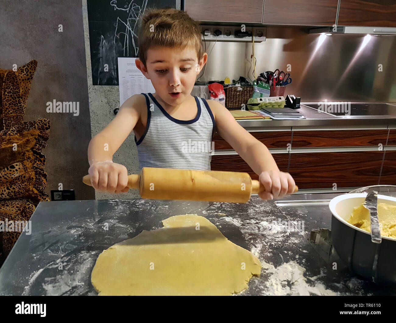 little boy baking cookies in a kitchen, Germany Stock Photo