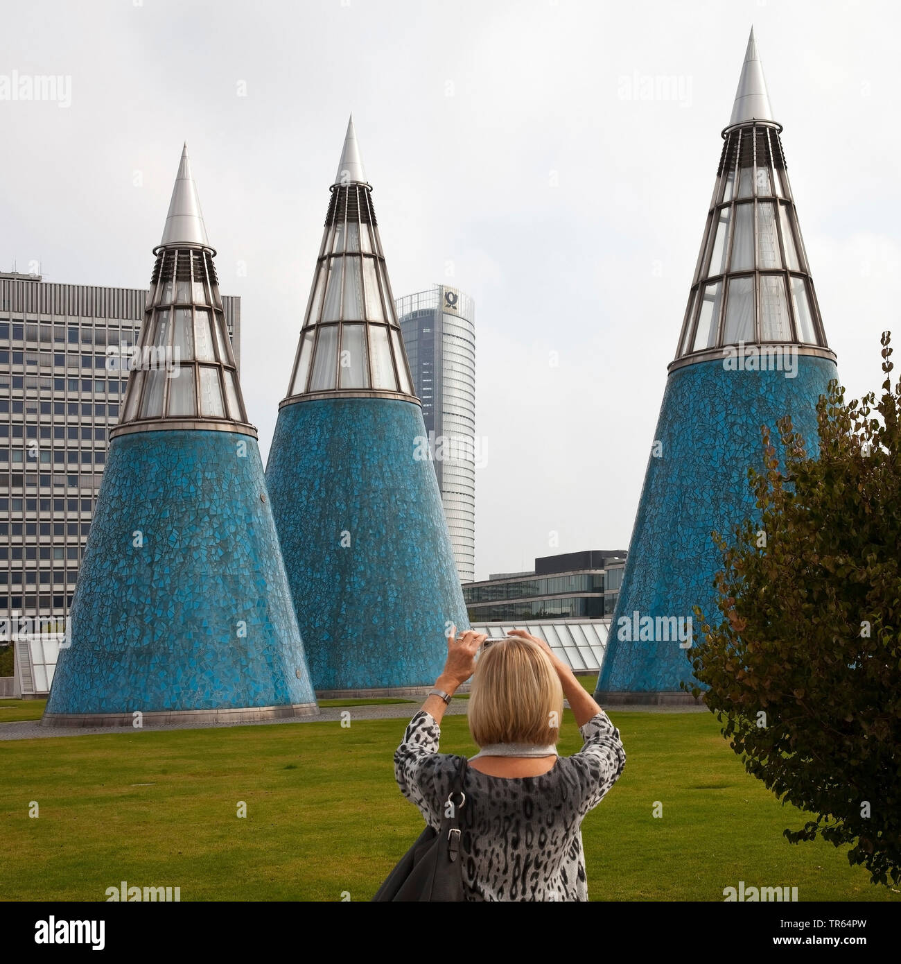 woman taking pictures of the conical light wells on the roof garden of the Art and Exhibition Hall, Germany, North Rhine-Westphalia, Bonn Stock Photo