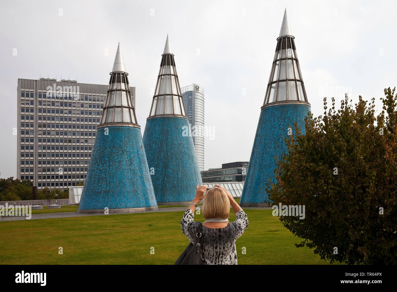 woman taking pictures of the conical light wells on the roof garden of the Art and Exhibition Hall, Germany, North Rhine-Westphalia, Bonn Stock Photo