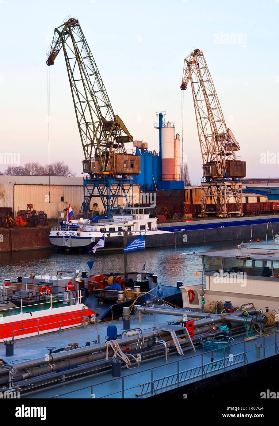 freight ships and cranes in inland port Duisburg, Germany, North Rhine-Westphalia, Ruhr Area, Duisburg Stock Photo
