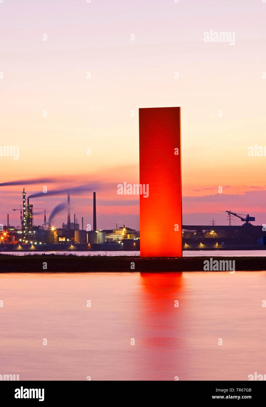 illuminated sculpture Rhine Orange in front of industrial scenery, Germany, North Rhine-Westphalia, Ruhr Area, Duisburg Stock Photo