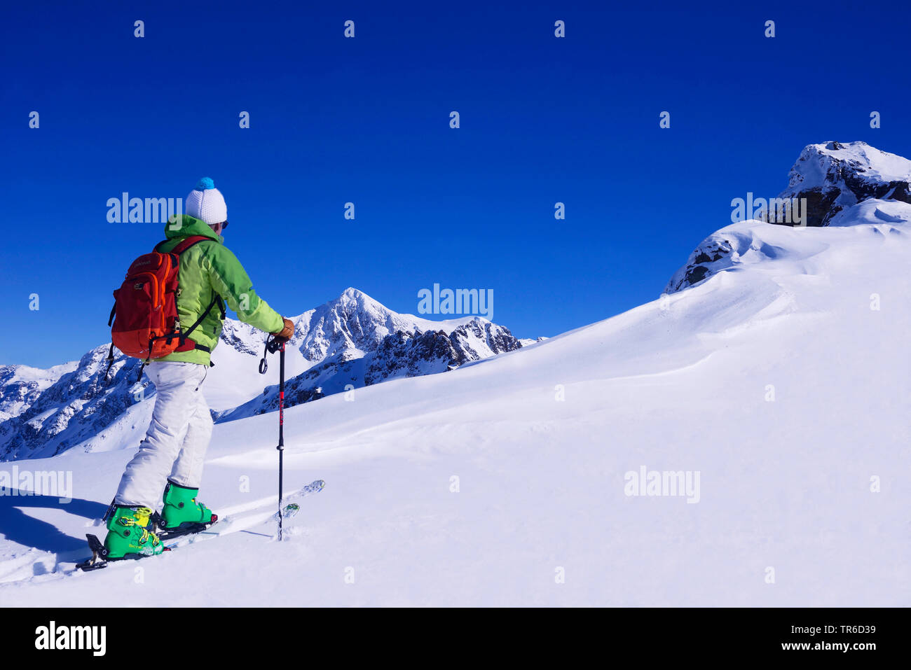 Ski tourer in snowy mountain scenery, France, Savoie, Sainte Foy Tarentaise Stock Photo