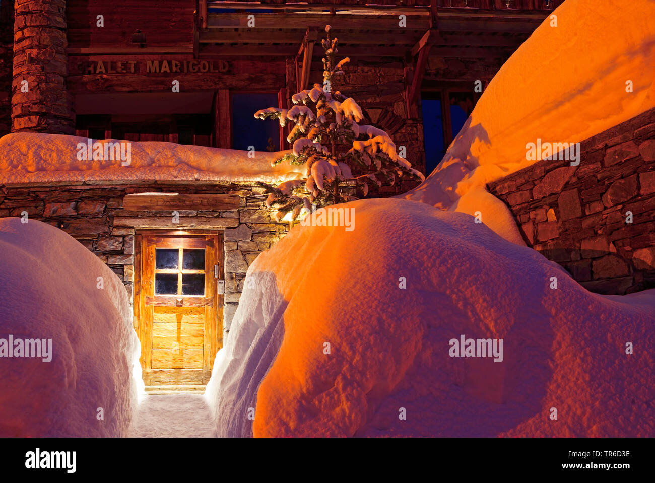snowy access to a chalet at night, France, Savoie, Sainte Foy Tarentaise Stock Photo