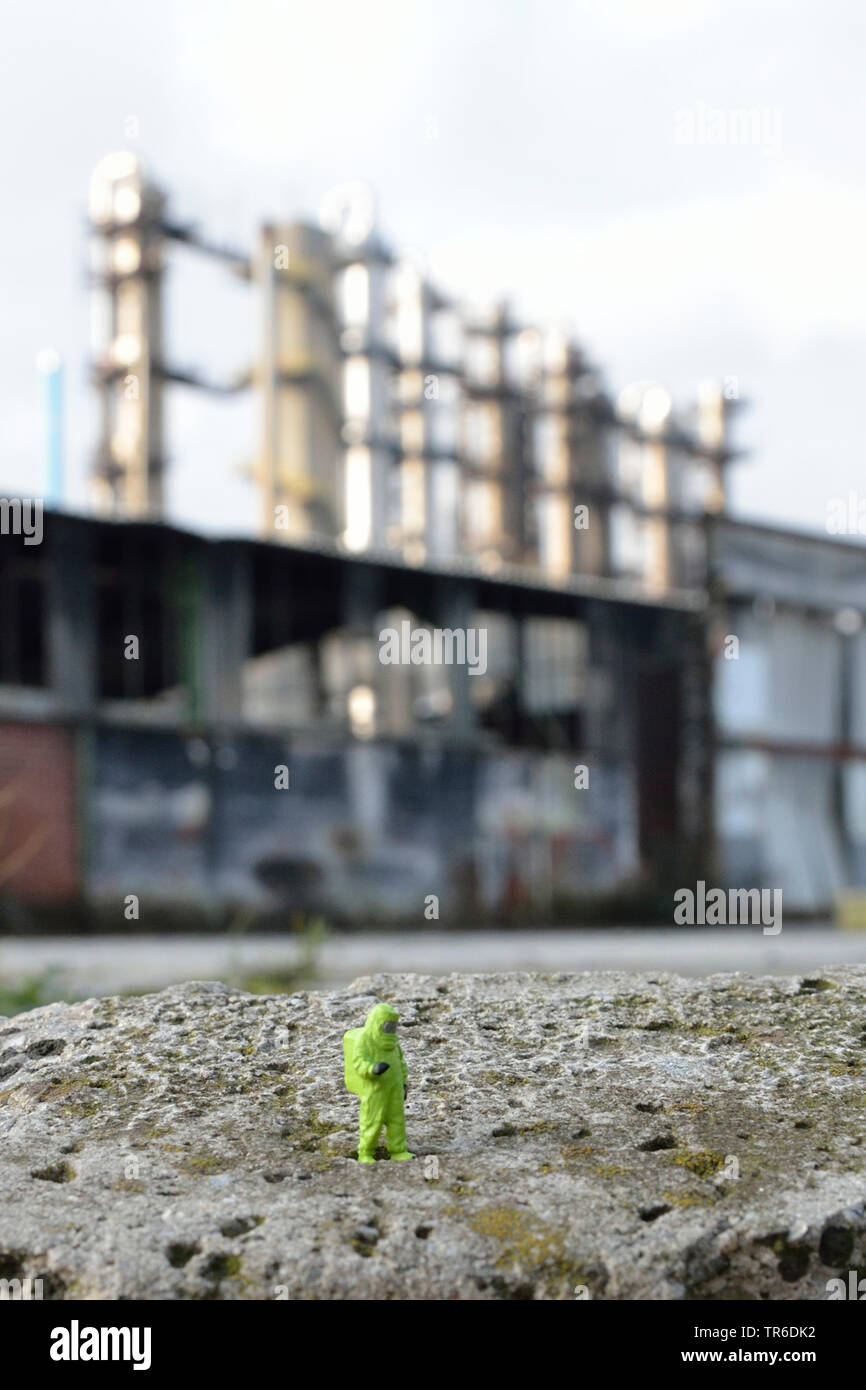 model railway figures with hazmat suit in front of a refinery, Germany, North Rhine-Westphalia, Ruhr Area Stock Photo