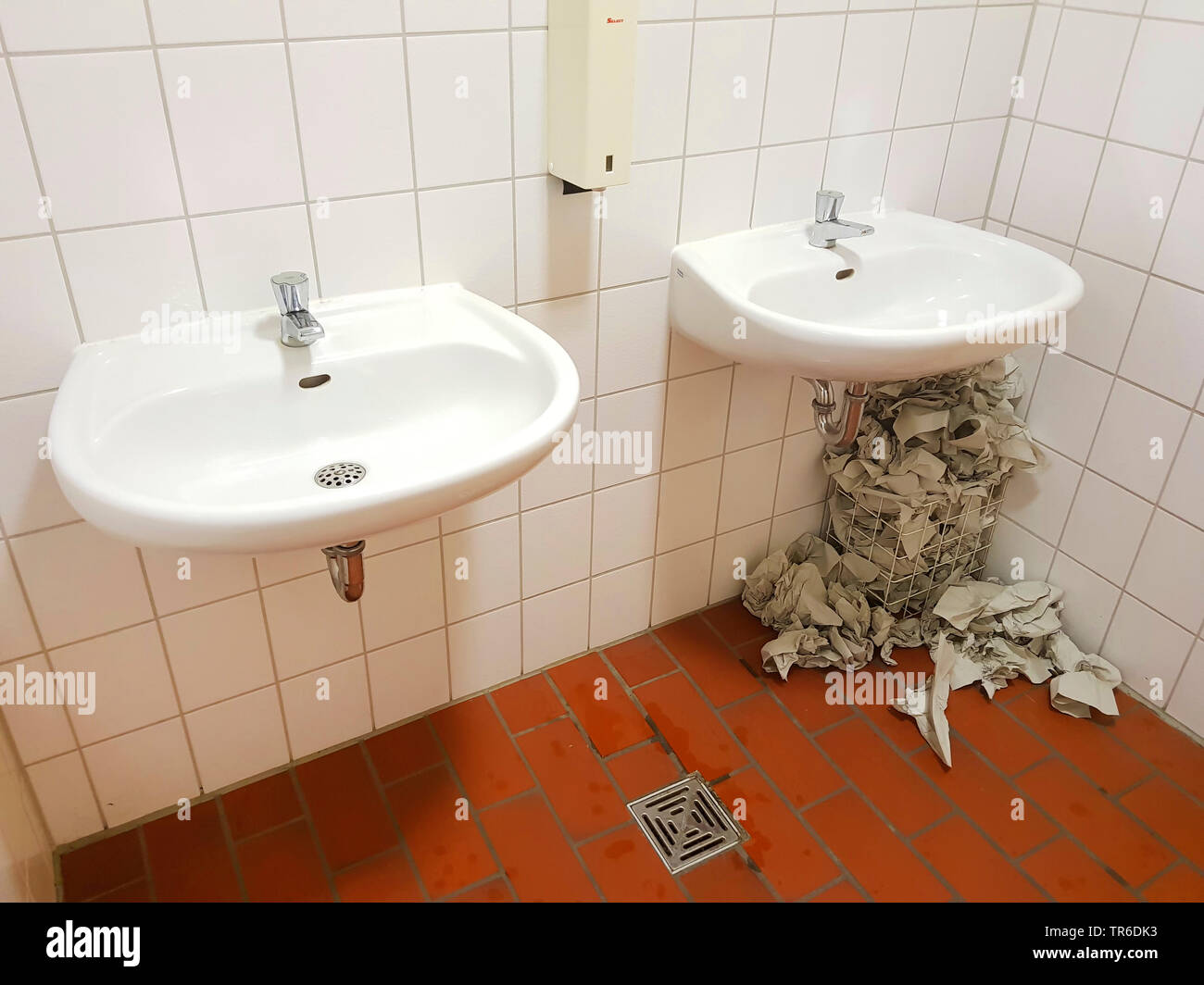 trash can overfilled with paper towel in an public restroom, Germany Stock Photo