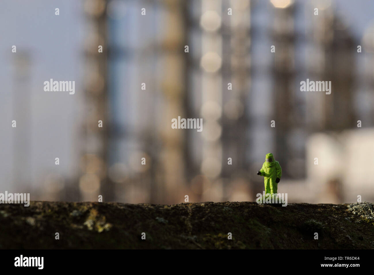 model railway figures with hazmat suit in front of a refinery, Germany, North Rhine-Westphalia, Ruhr Area Stock Photo