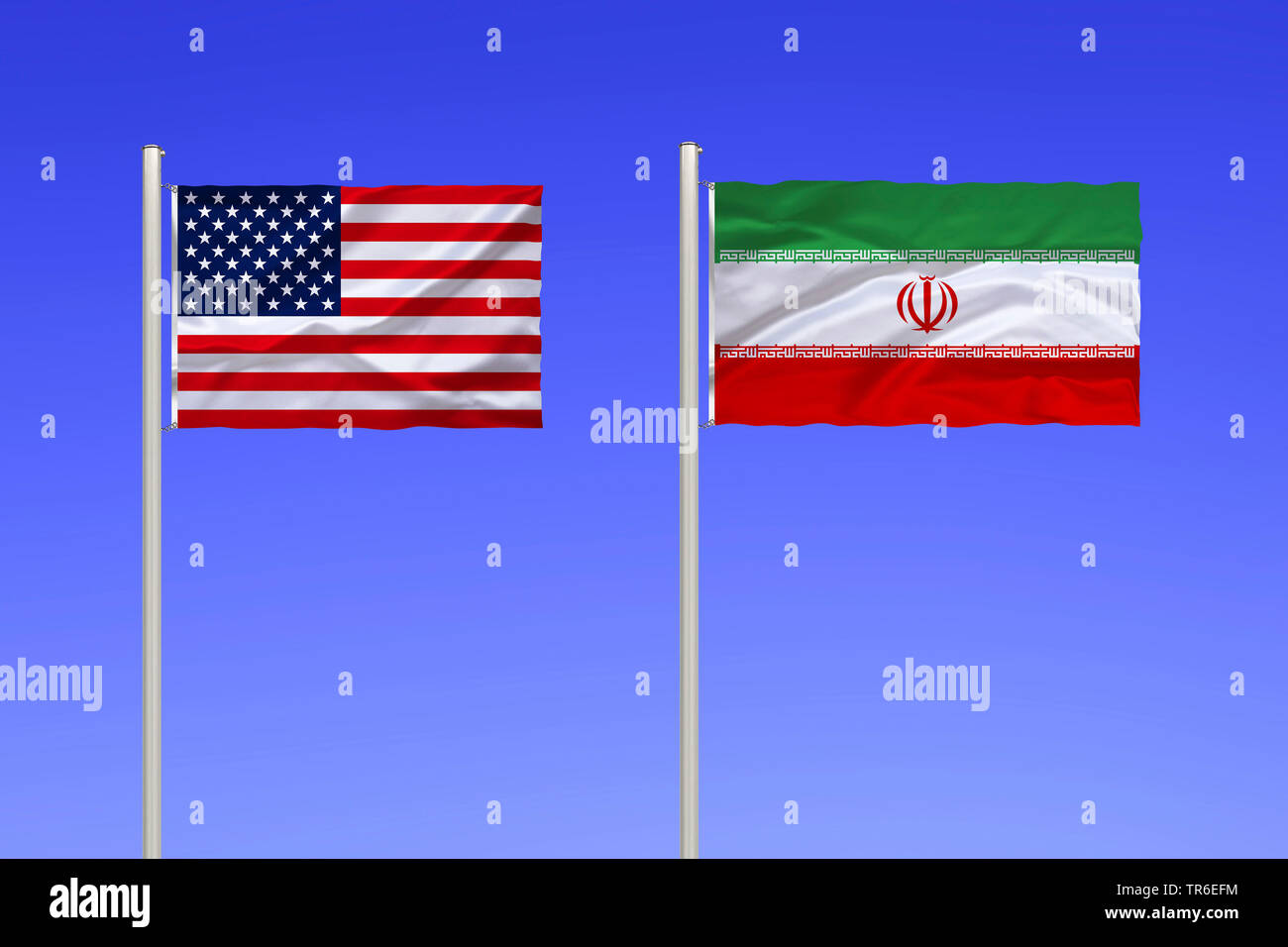 flags of USA and Iran against blue sky, Iran Stock Photo