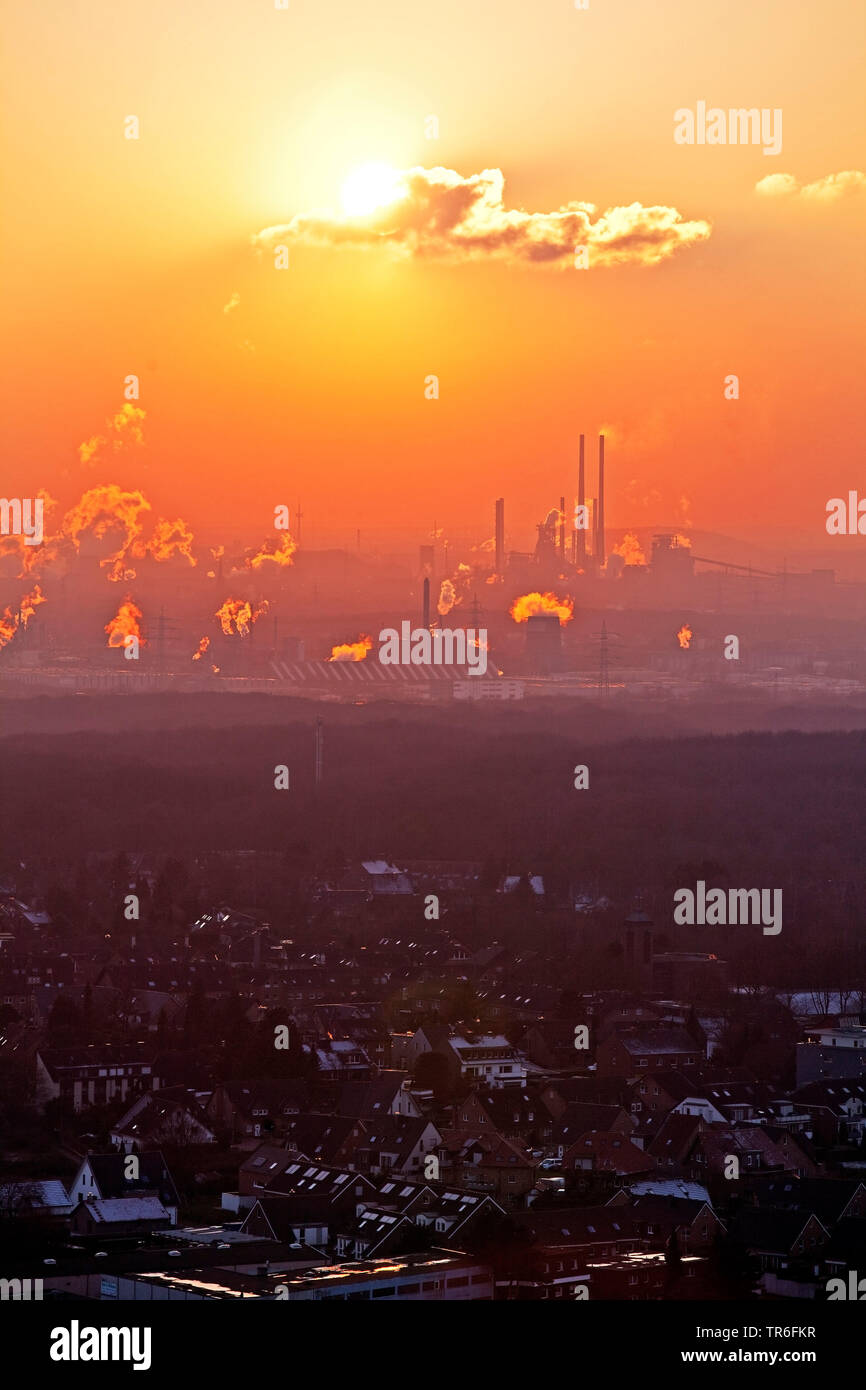 view from spoil tip Haniel to industrial scenery at sunset, Germany, North Rhine-Westphalia, Ruhr Area, Bottrop Stock Photo