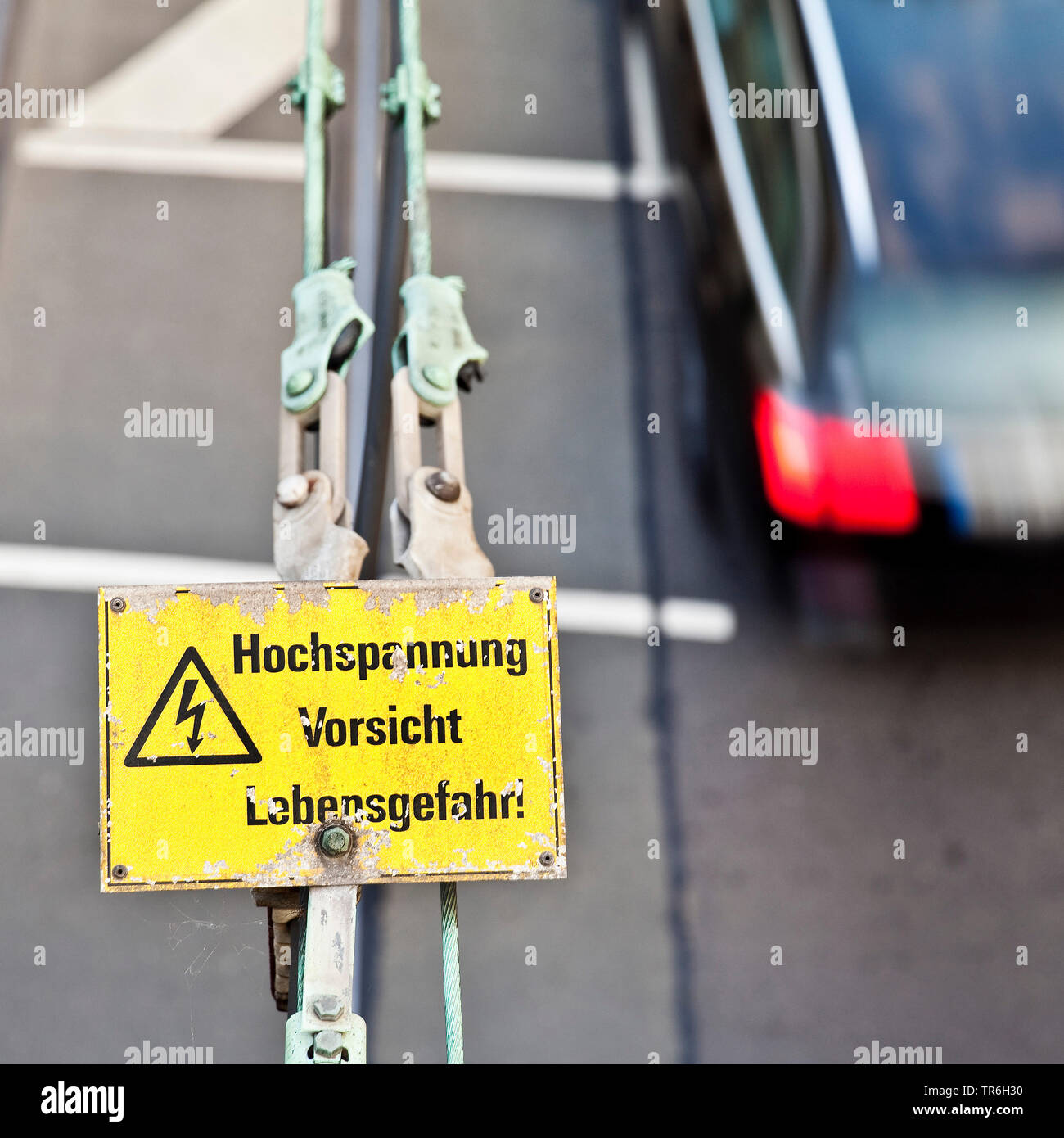 contact wire and warning sign 'high voltage, caution, danger of life', Germany, North Rhine-Westphalia, Duesseldorf Stock Photo