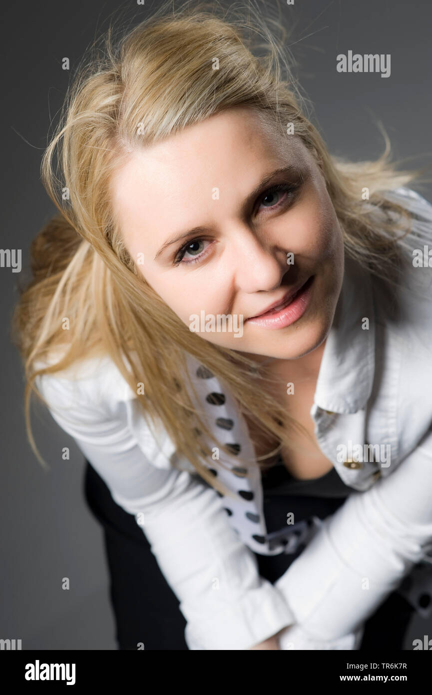 Bending blond young woman in hi-res stock photography and images - Alamy