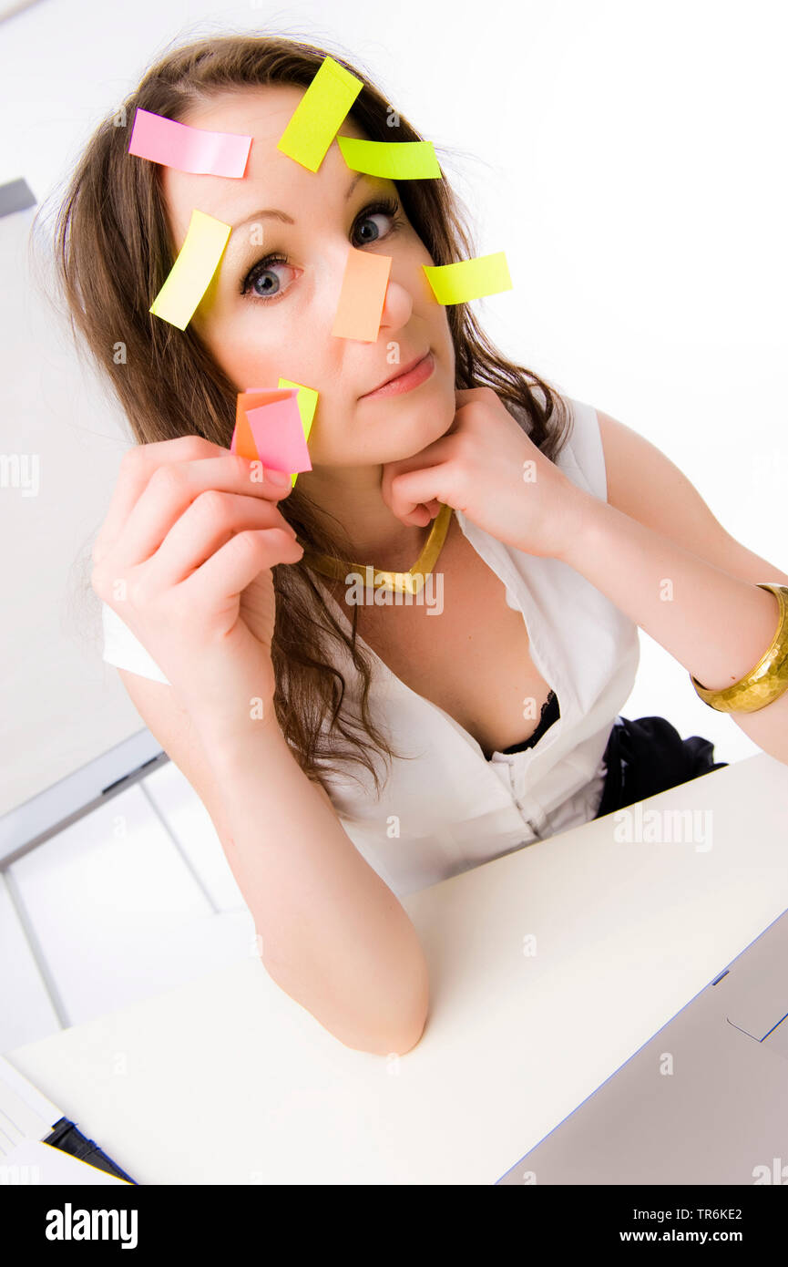 clerk with many postits on face Stock Photo Alamy