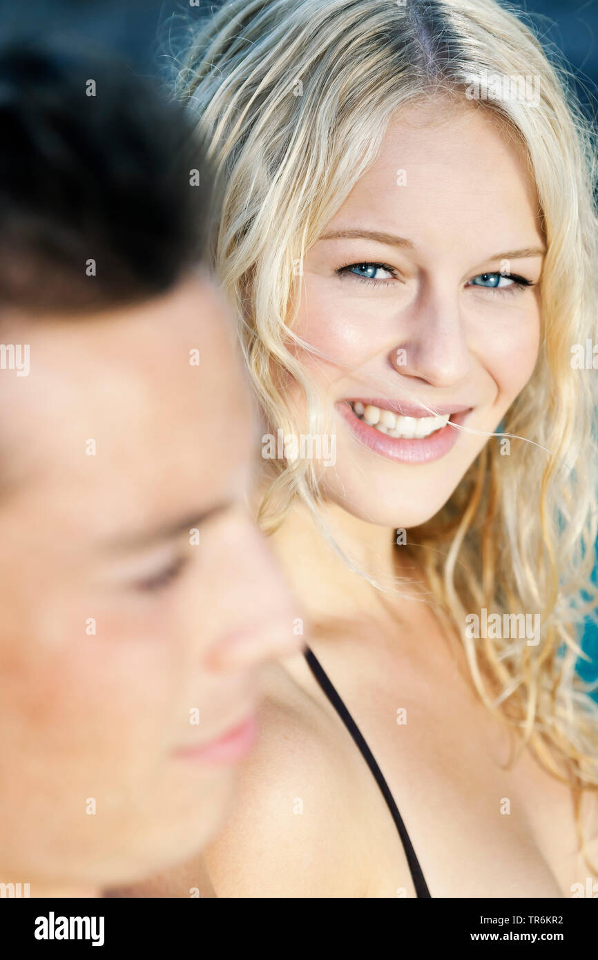 young couple relaxing at a pool, Germany Stock Photo