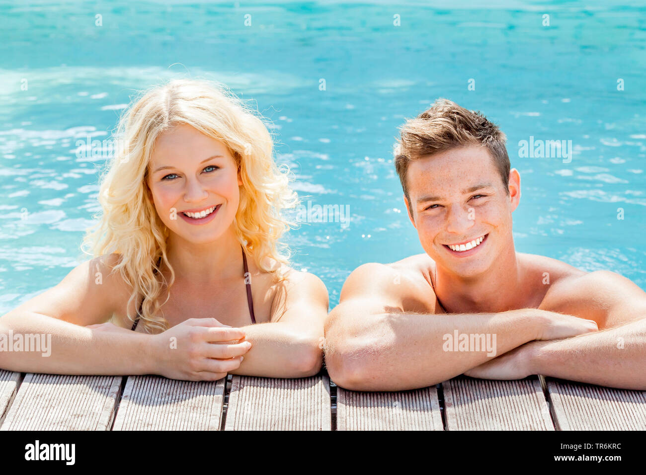 young couple relaxing at a pool, Germany Stock Photo