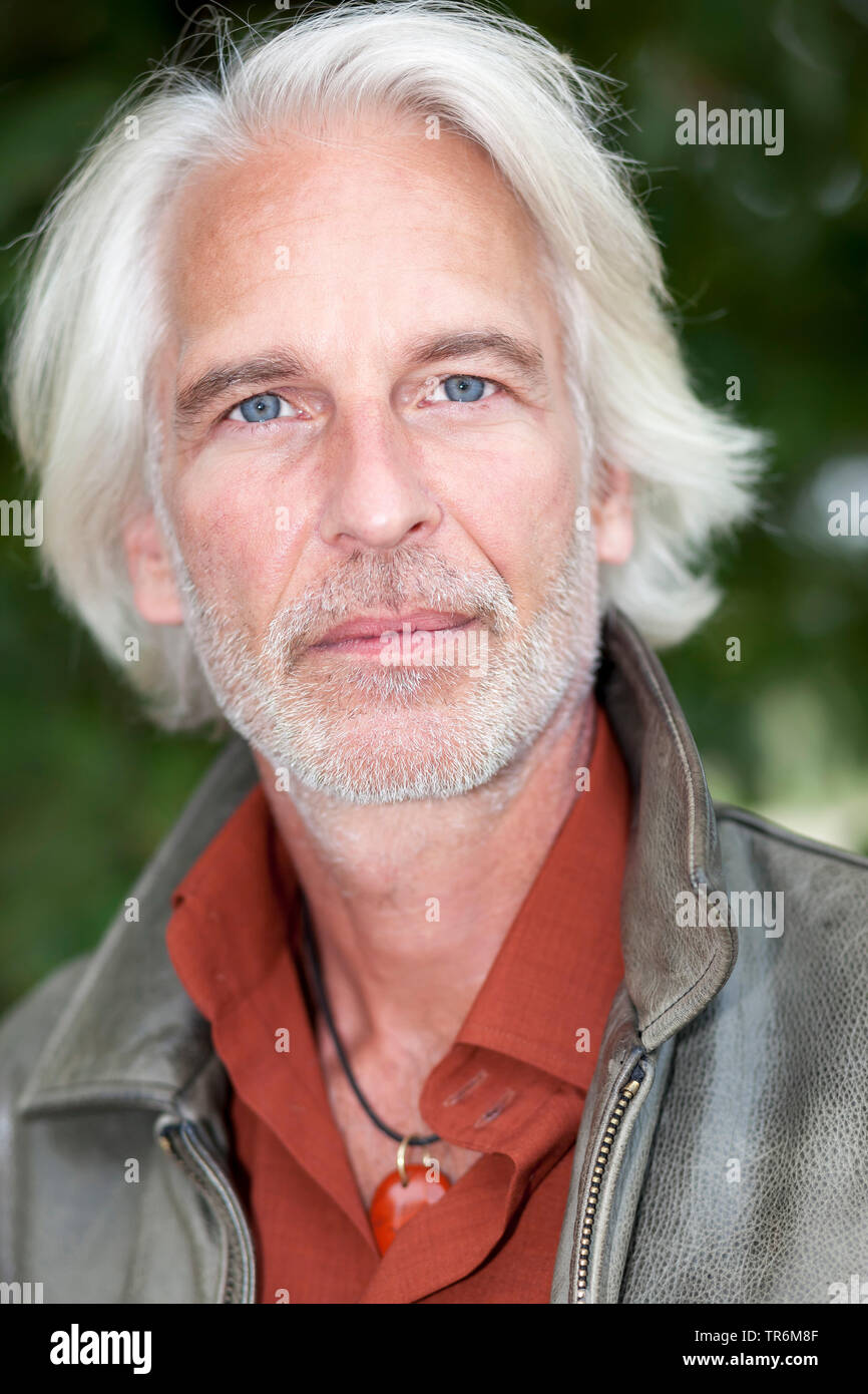 elderly man with grey long hair and leather jacket, Germany Stock Photo -  Alamy